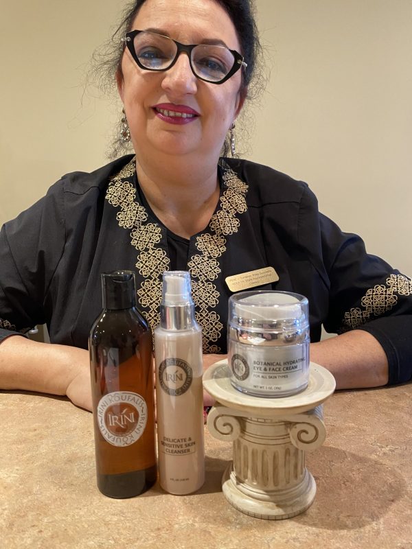 Esthetician posing with products
